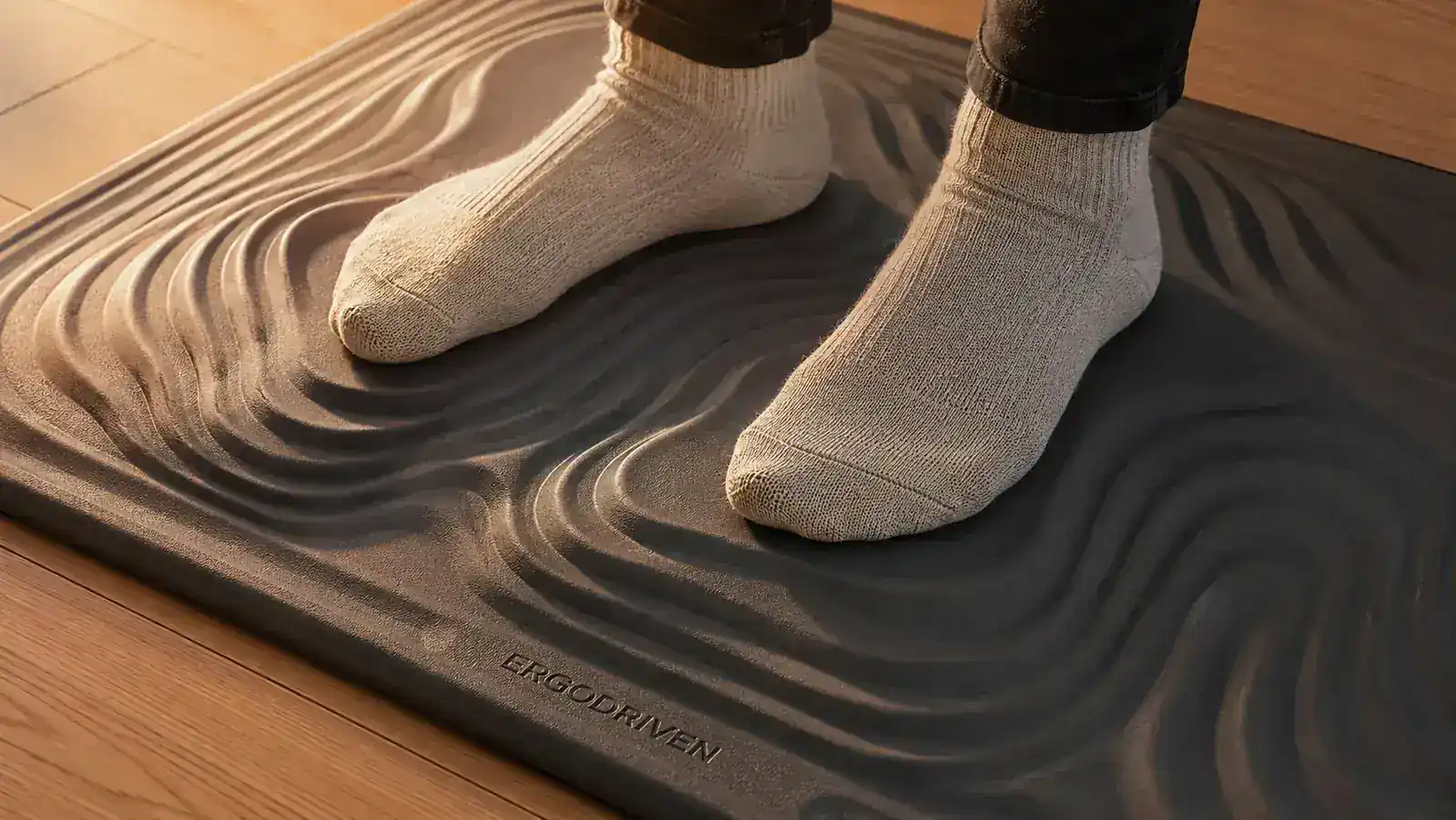 Close-up of the edge border and textured surface of the Ergodriven Topo anti-fatigue mat