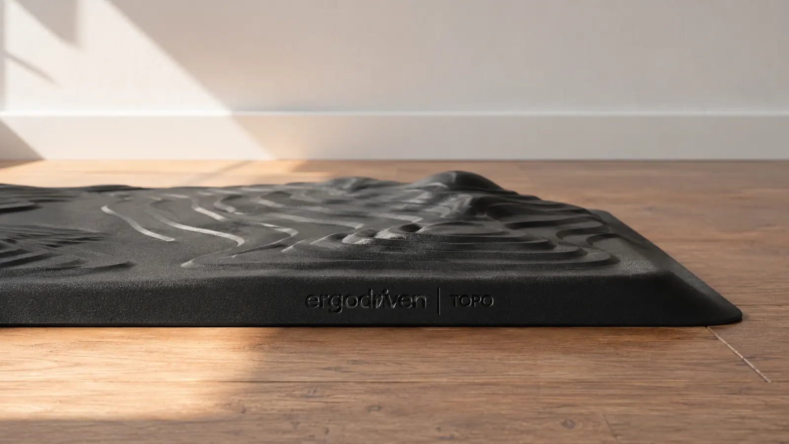 Bottom view of the Ergodriven Topo mat showing the textured non-slip underside after heavy daily use
